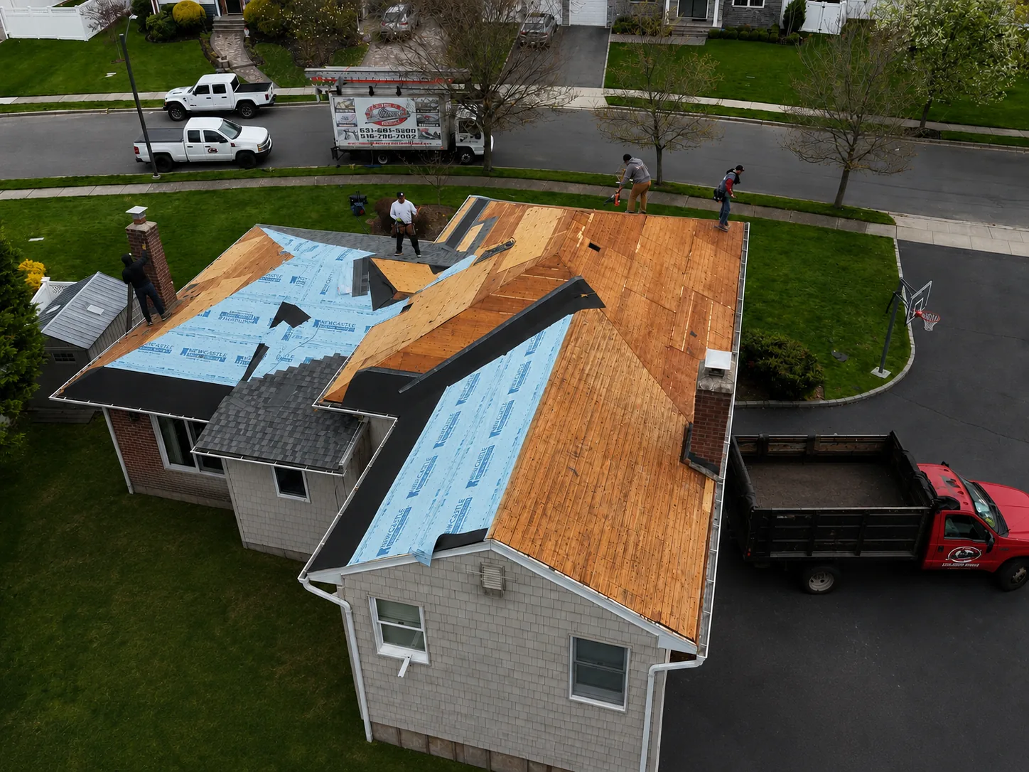 Newly replaced asphalt shingle roof on a Long Island home
